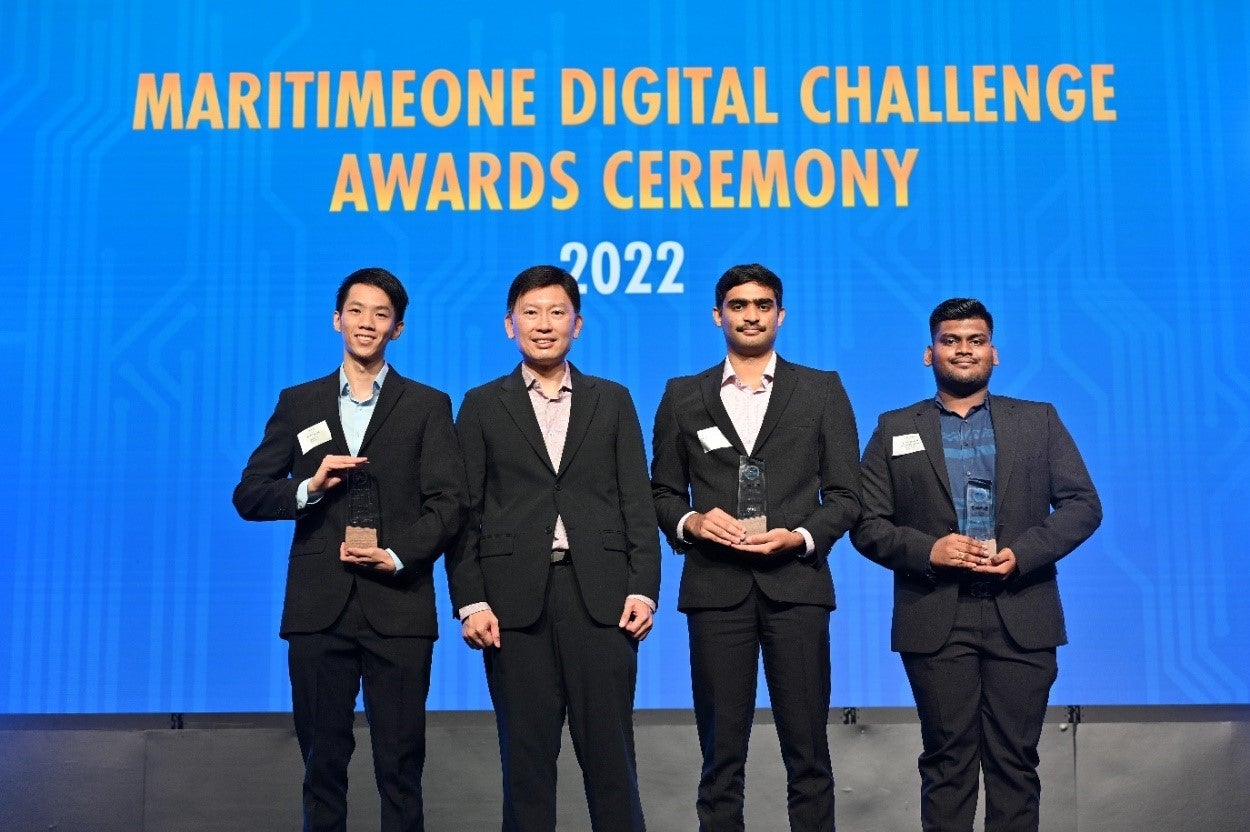 The team received their award from Minister Chee (second from left)  