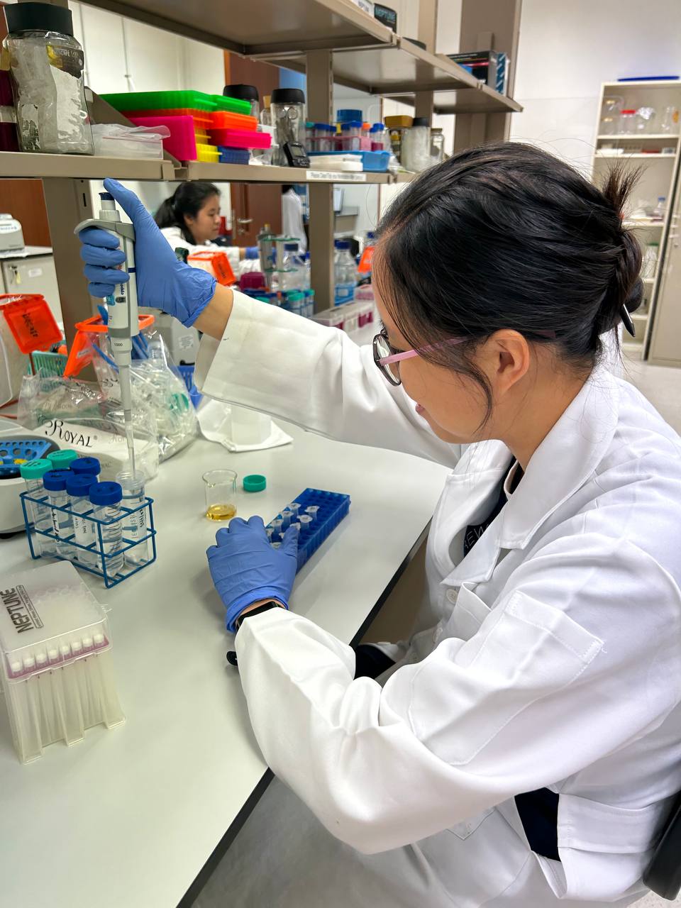 Pipetting ethanol to wash the DNA pellet.