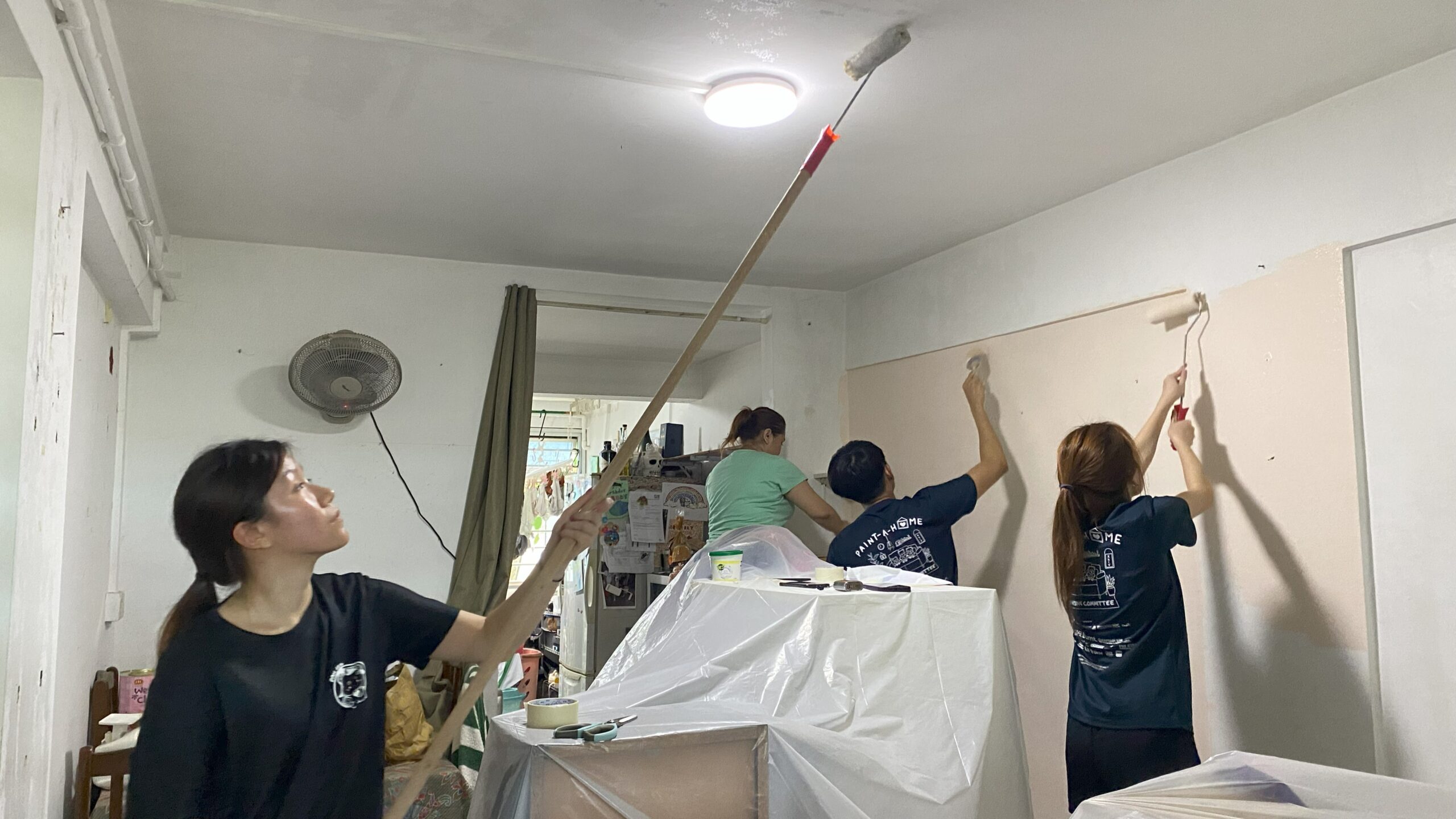 With paint tubs, brushes and tools in hand, the Paint-A-Home teams sprang into action, making a difference in the homes of low-income families.