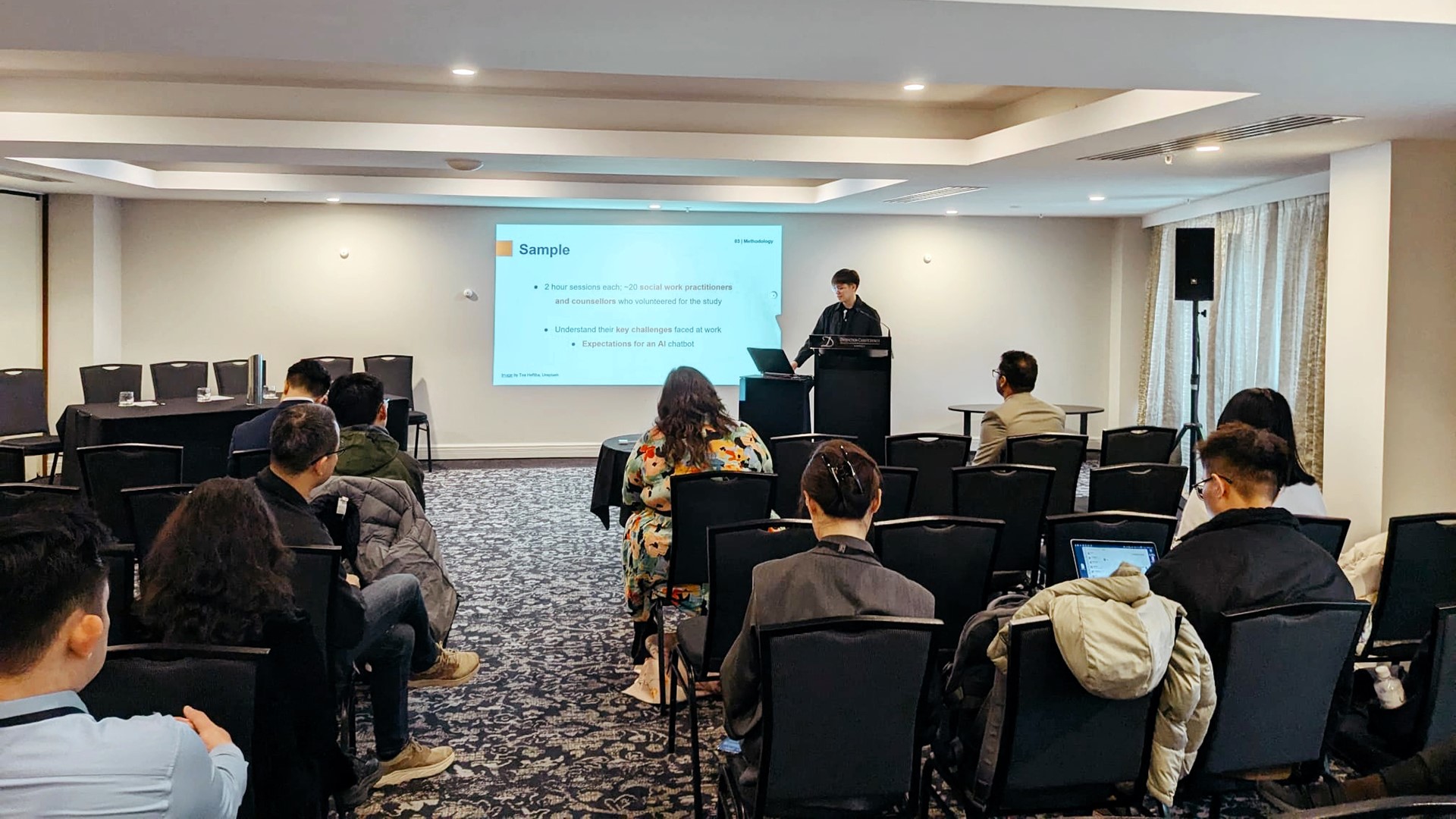 Wayne presenting the research project he worked on under the guidance of Communications and New Media Assistant Professor Dr Renwen Zhang, which involved collaborating with social service agencies to understand their attitudes toward Generative AI and co-design AI solutions to support social workers in their administrative and frontline work.