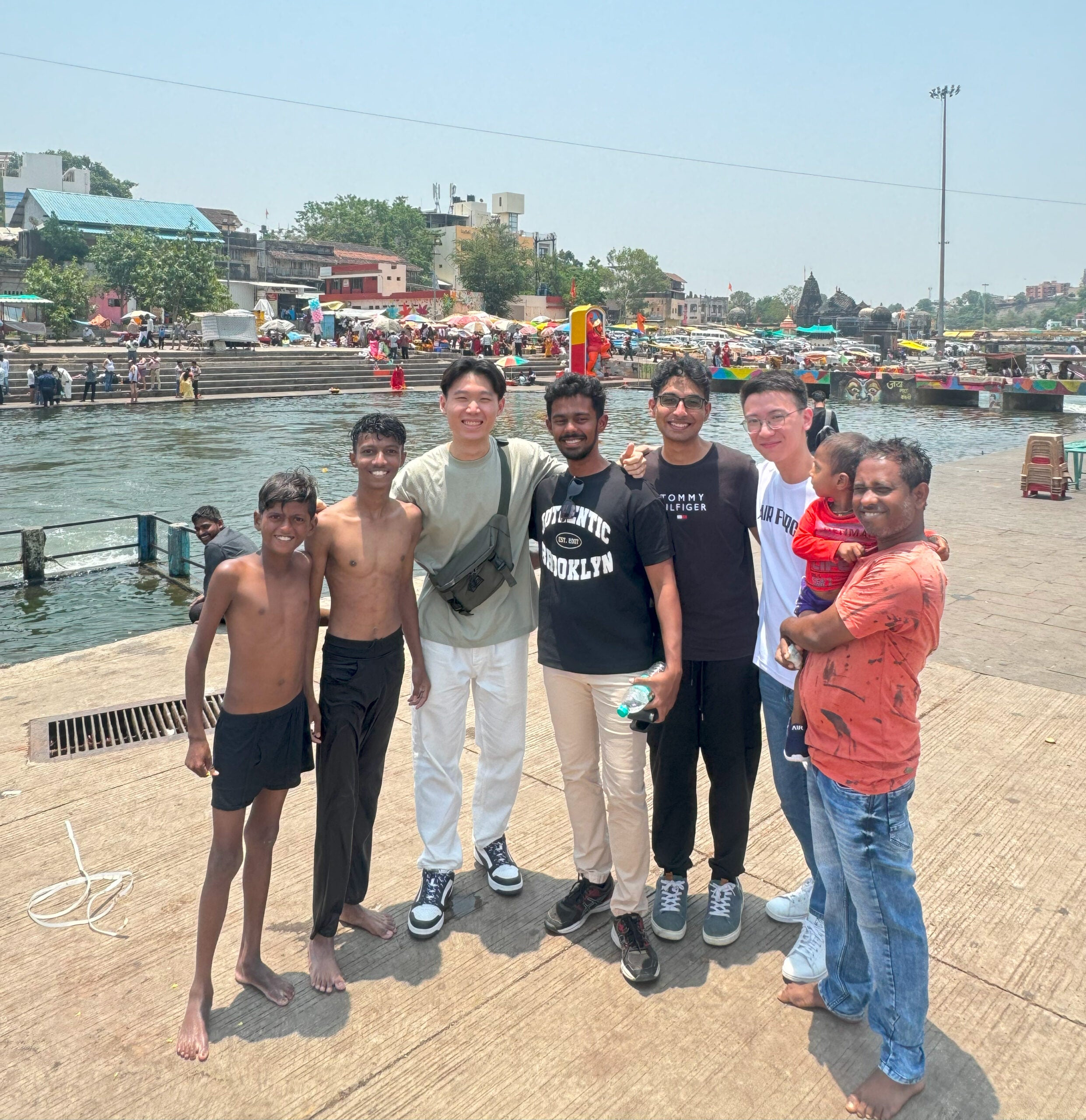 Group photo taken when we visited a local river, where many of the locals were swimming to avoid the hot weather. The local children came up to us and wanted to take a photo with us.